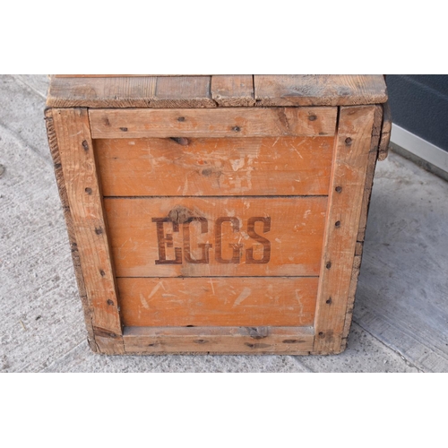 313 - A vintage 20th century wooden egg crate with either 'WCB' or 'WGB' with 'EGGS' on each side and a bo... 