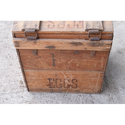 313 - A vintage 20th century wooden egg crate with either 'WCB' or 'WGB' with 'EGGS' on each side and a bo... 