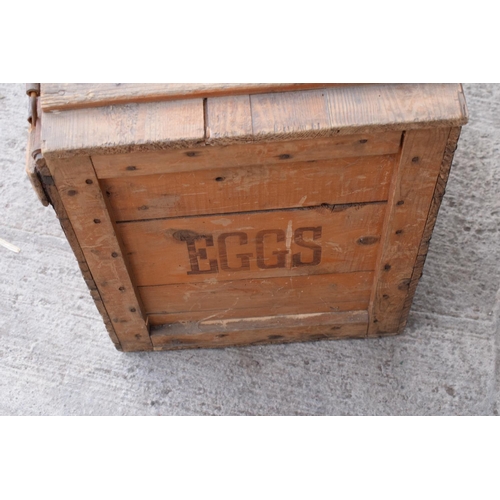 313 - A vintage 20th century wooden egg crate with either 'WCB' or 'WGB' with 'EGGS' on each side and a bo... 