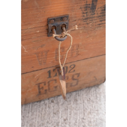 313 - A vintage 20th century wooden egg crate with either 'WCB' or 'WGB' with 'EGGS' on each side and a bo... 