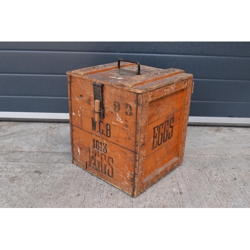 314 - A vintage 20th century wooden egg crate with either 'WCB' or 'WGB' with 'EGGS' on each side and a bo... 