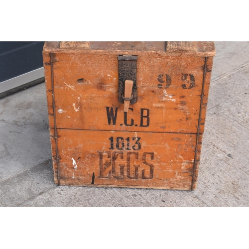 314 - A vintage 20th century wooden egg crate with either 'WCB' or 'WGB' with 'EGGS' on each side and a bo... 