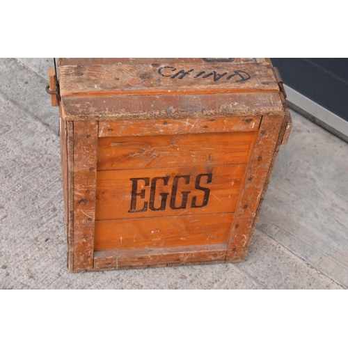 314 - A vintage 20th century wooden egg crate with either 'WCB' or 'WGB' with 'EGGS' on each side and a bo... 