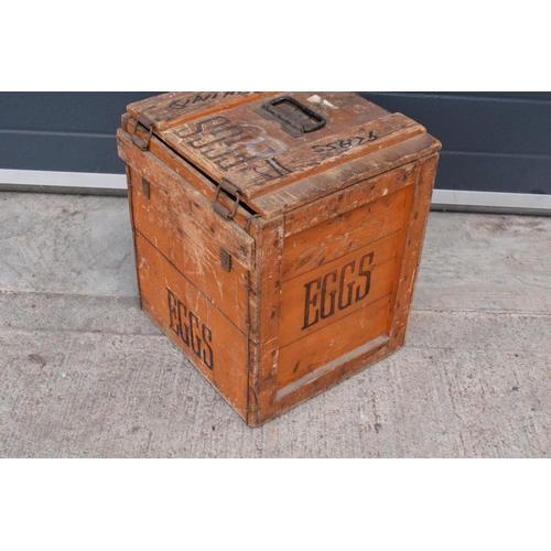 314 - A vintage 20th century wooden egg crate with either 'WCB' or 'WGB' with 'EGGS' on each side and a bo... 