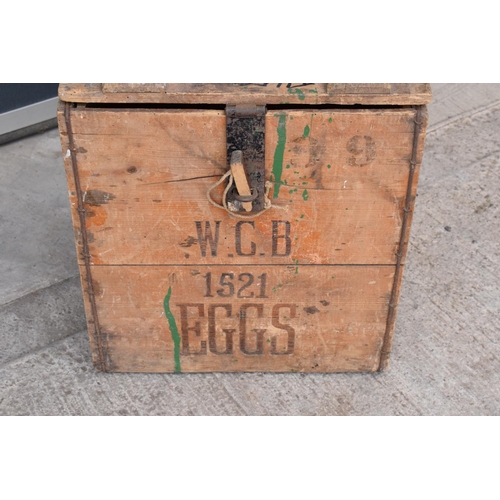 315 - A vintage 20th century wooden egg crate with either 'WCB' or 'WGB' with 'EGGS' on each side and a bo... 