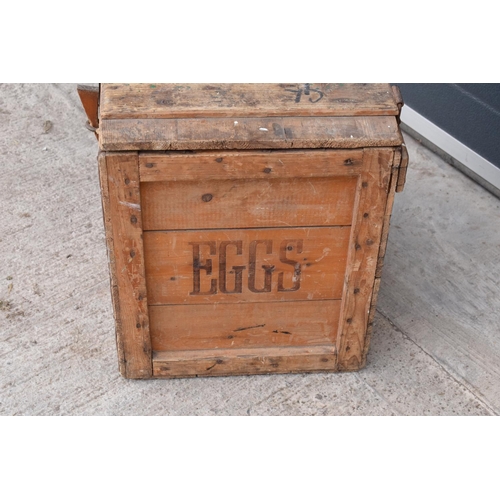 315 - A vintage 20th century wooden egg crate with either 'WCB' or 'WGB' with 'EGGS' on each side and a bo... 