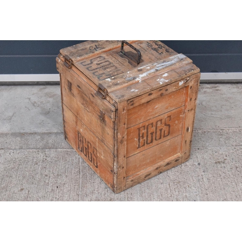 315 - A vintage 20th century wooden egg crate with either 'WCB' or 'WGB' with 'EGGS' on each side and a bo... 