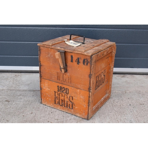 316 - A vintage 20th century wooden egg crate with either 'WCB' or 'WGB' with 'EGGS' on each side and a bo... 