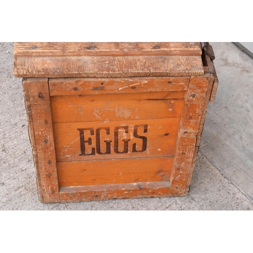 316 - A vintage 20th century wooden egg crate with either 'WCB' or 'WGB' with 'EGGS' on each side and a bo... 