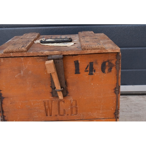 316 - A vintage 20th century wooden egg crate with either 'WCB' or 'WGB' with 'EGGS' on each side and a bo... 