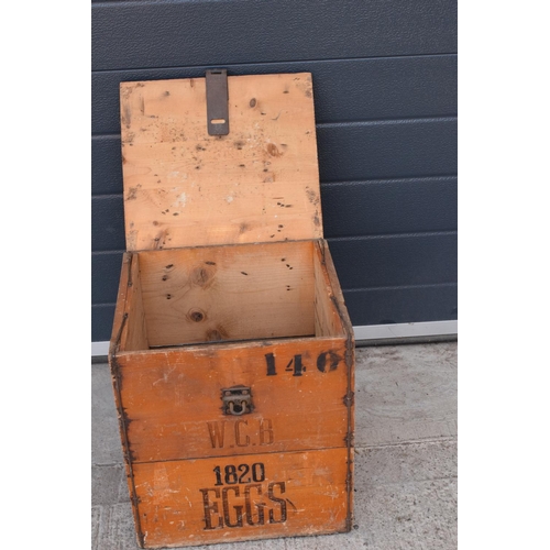 316 - A vintage 20th century wooden egg crate with either 'WCB' or 'WGB' with 'EGGS' on each side and a bo... 