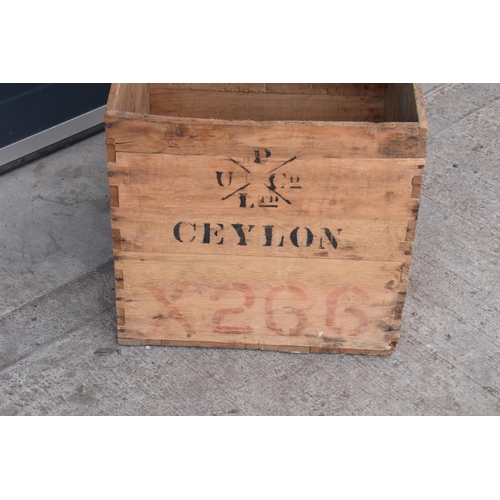 317 - A vintage wooden advertising crate with 'Ceylon' and 'London' marked onto the sides amongst other in... 