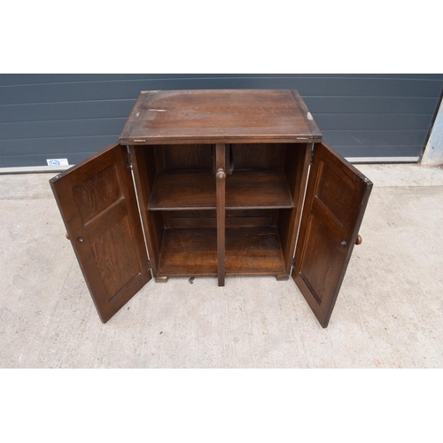 327 - A wooden 20th century Priory style sideboard with a fold-out table top. Largest dimensions 138 x 70 ... 