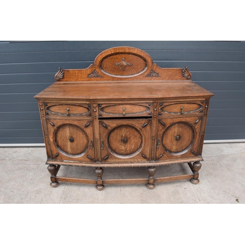 331 - An Edwardian carved sideboard with 3 drawers over 3 cupboards. 153 x 55 x 131cm. One drawer is in ne... 