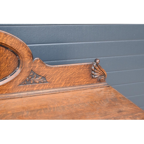 331 - An Edwardian carved sideboard with 3 drawers over 3 cupboards. 153 x 55 x 131cm. One drawer is in ne... 