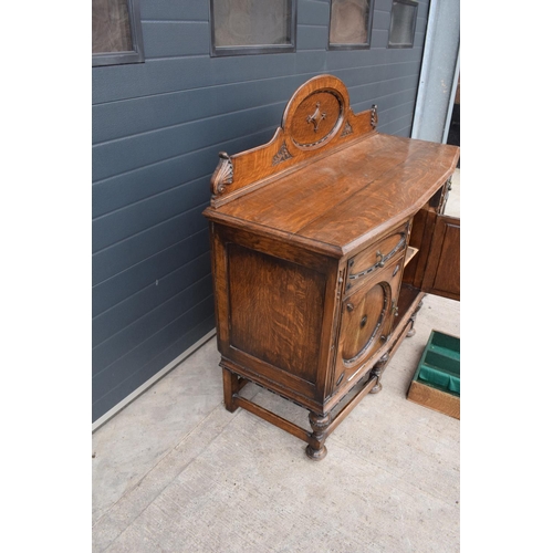 331 - An Edwardian carved sideboard with 3 drawers over 3 cupboards. 153 x 55 x 131cm. One drawer is in ne... 