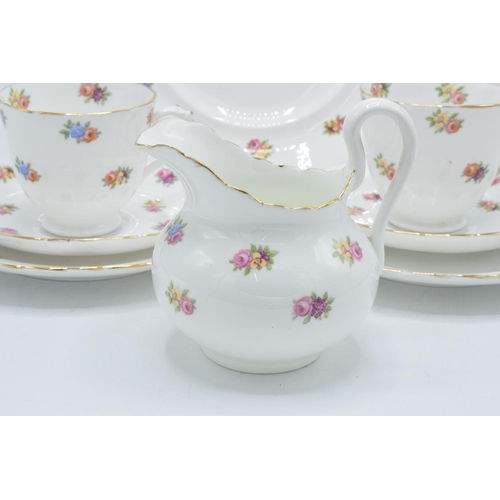 44 - A collection of Tuscan China tea ware in a floral pattern to consist of 12 cups, 11 saucers, 12 side... 