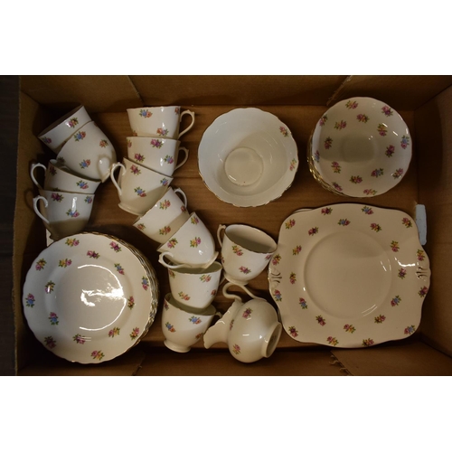 44 - A collection of Tuscan China tea ware in a floral pattern to consist of 12 cups, 11 saucers, 12 side... 