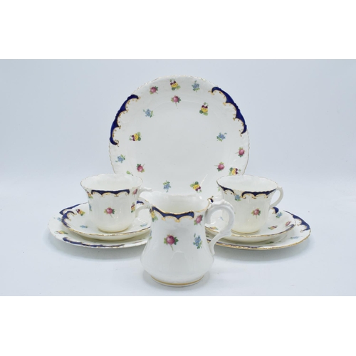 47 - The Paragon China blue floral tea set circa 1912 to consist of 8 trios, 4 further side plates, a cak... 