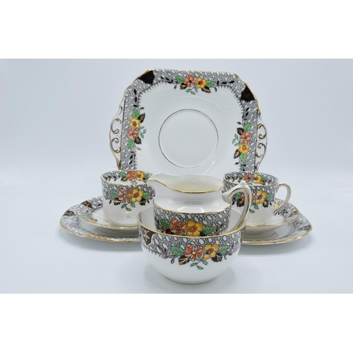 48 - A collection of late 19th/ early 20th century Staffordshire tea ware with a floral design to include... 