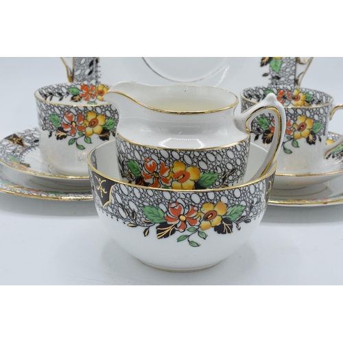 48 - A collection of late 19th/ early 20th century Staffordshire tea ware with a floral design to include... 