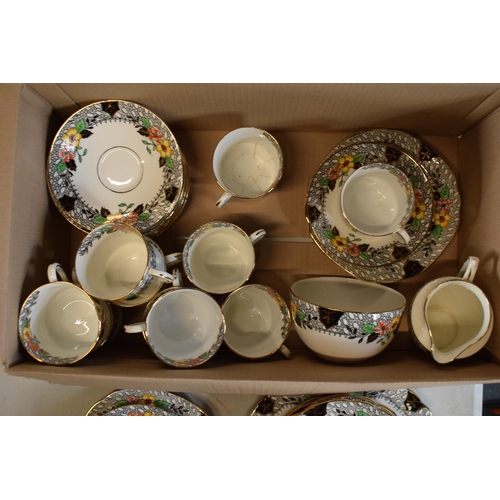 48 - A collection of late 19th/ early 20th century Staffordshire tea ware with a floral design to include... 