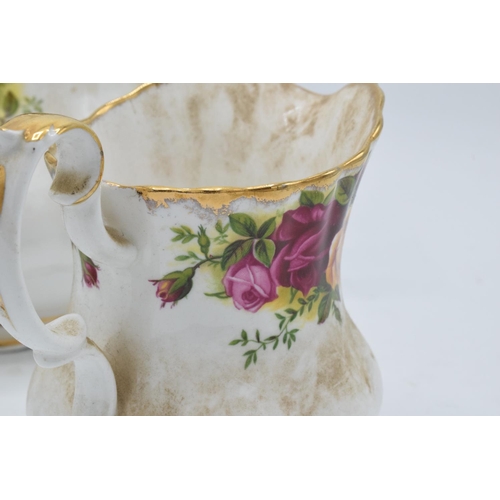 55A - A collection of Royal Albert Old Country Roses items to include a large teapot, milk and sugar (3). ... 