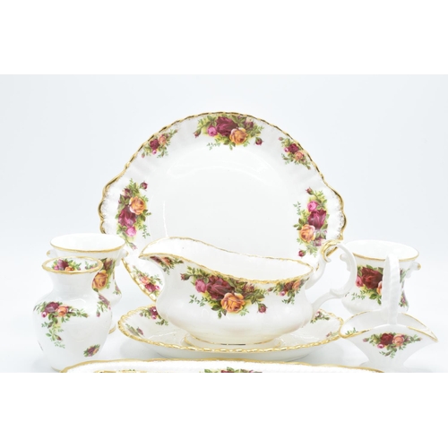 58 - A collection of Royal Albert Old Country Roses items to include a gravy boat and saucer, a cake plat... 