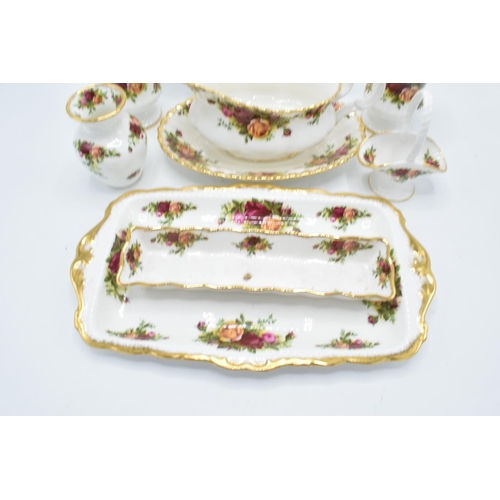 58 - A collection of Royal Albert Old Country Roses items to include a gravy boat and saucer, a cake plat... 