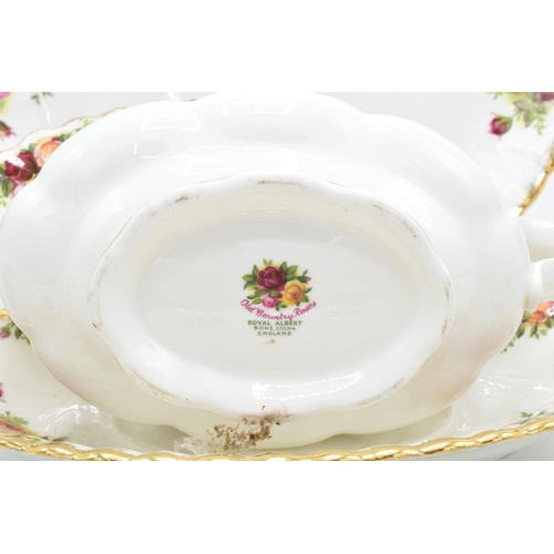 58 - A collection of Royal Albert Old Country Roses items to include a gravy boat and saucer, a cake plat... 