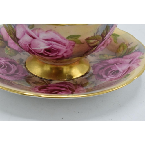 74 - Aynsley Bone China cup and saucer duo in a pink floral design (2). In good condition with no obvious... 