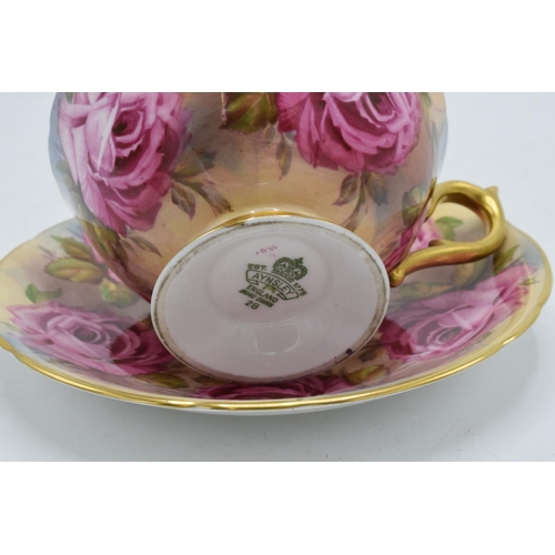 74 - Aynsley Bone China cup and saucer duo in a pink floral design (2). In good condition with no obvious... 