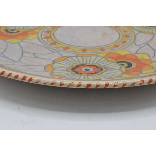 79 - Crown Ducal Charlotte Rhead 1930s tubelined charger in a stylised floral design 32.5cm diameter. In ... 