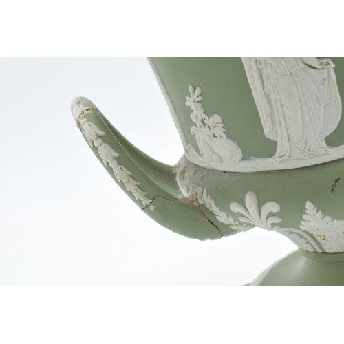 87 - Wedgwood Sage Green Jasperware twin-handled lidded urn (a/f). The main body is generally in good con... 