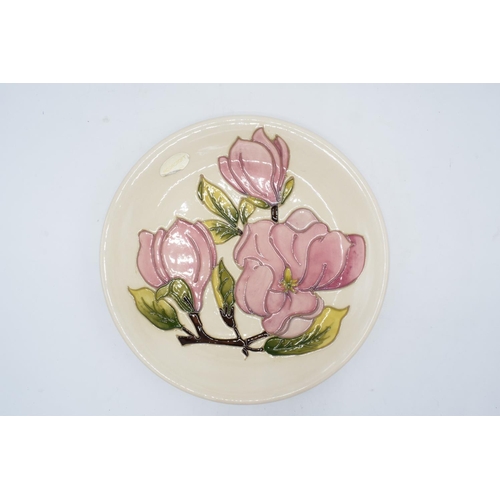 95 - Large Moorcroft plate in the Pink Magnolia design on a cream background with original Moorcroft stic... 