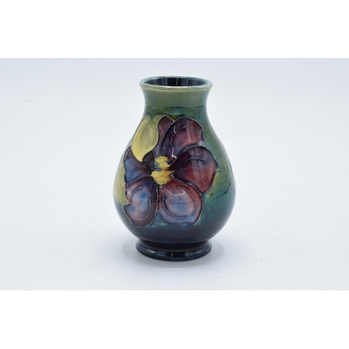 98 - Moorcroft vase in the Clematis pattern on a green background. 10cm tall. In good condition with no o... 