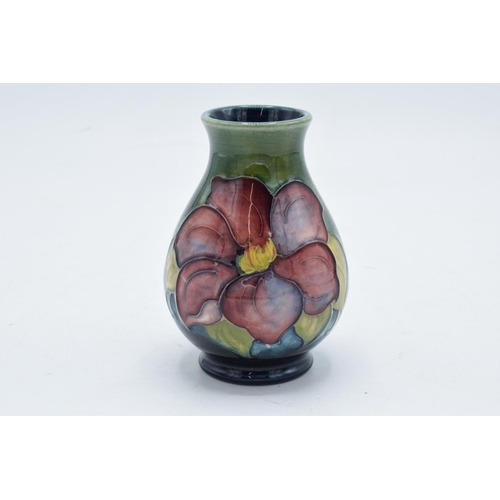 98 - Moorcroft vase in the Clematis pattern on a green background. 10cm tall. In good condition with no o... 