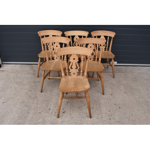 377 - A set of 6 matching antique style hardwood kitchen chairs with ornate backs (6). 84cm tall. Set 3. I... 