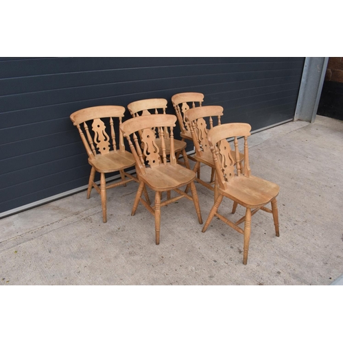 377 - A set of 6 matching antique style hardwood kitchen chairs with ornate backs (6). 84cm tall. Set 3. I... 