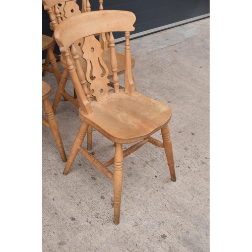 377 - A set of 6 matching antique style hardwood kitchen chairs with ornate backs (6). 84cm tall. Set 3. I... 