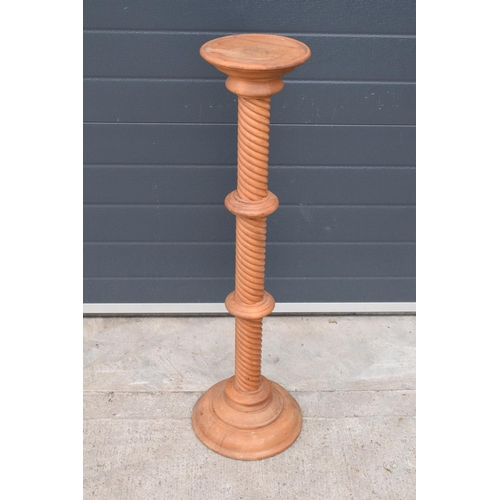 384 - A 20th century wooden plantstand with a twist decoration. 99cm tall.