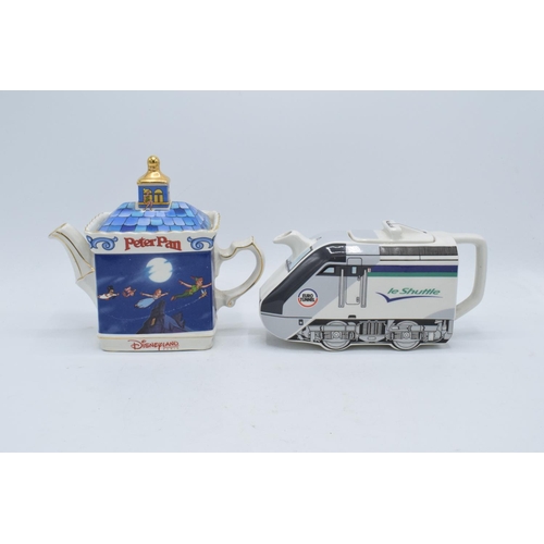 80A - A pair of James Sadler teapots to include Le Shuttle commissioned by Eurotunnel and Peter Pan made f... 