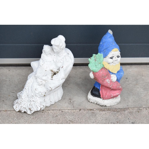 301J - A collection of vintage garden ornaments to include a garden gnome, a figure of a couple and one sim... 