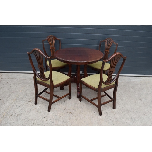 386 - A 20th century set of table and 4 chairs with carved wheat design on the top. In good functional con... 