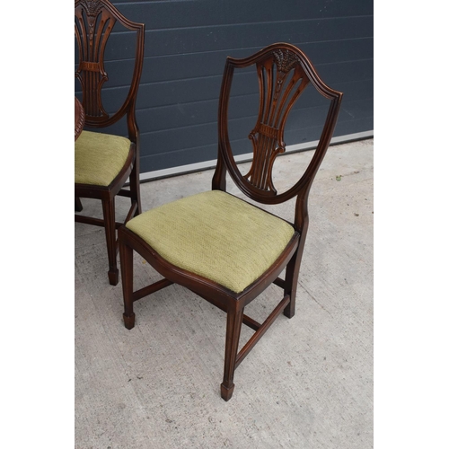 386 - A 20th century set of table and 4 chairs with carved wheat design on the top. In good functional con... 