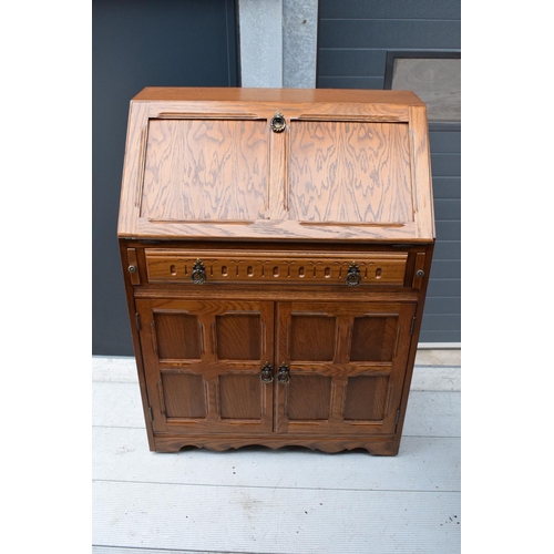 387 - A 20th century wooden bureau in the Old Charm style. 77 x 45 x 100cm.