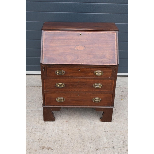 390 - A 19th century inlaid mahogany bureau with the fall front revealing a fitted interior inlaid with a ... 