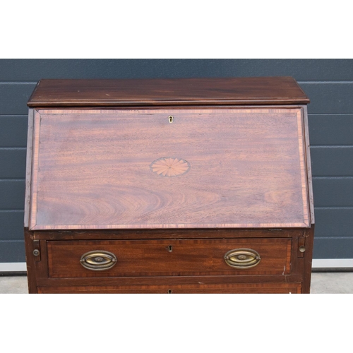 390 - A 19th century inlaid mahogany bureau with the fall front revealing a fitted interior inlaid with a ... 