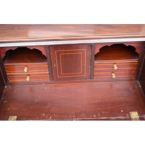 390 - A 19th century inlaid mahogany bureau with the fall front revealing a fitted interior inlaid with a ... 