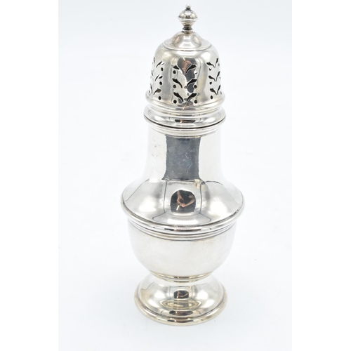 215C - A silver sugar sifter, Birmingham 1955. 80.4 grams. In good condition. 16cm tall.